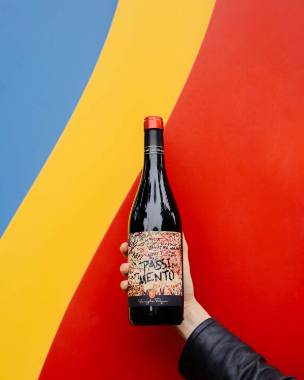 Pasqua Passimento Italian Red Wine On A Colourful Background