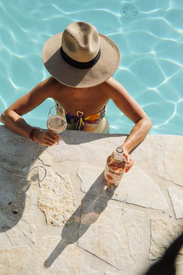 Woman In Pool With Pasqua 11 Minutes Italian Rose Wine In Glass