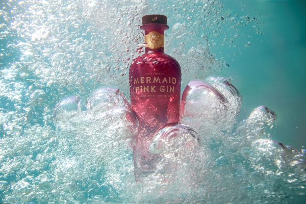Mermaid Pink Gin Bottle Shot In The Sea