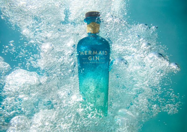 Mermaid Gin Blue Bottle In The Blue Of The Sea