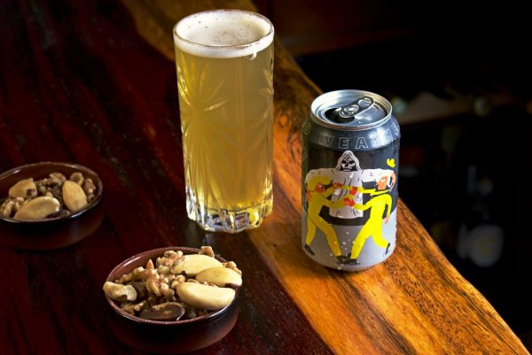 Mikkeller Weird Weather Beer In A Glass With Nuts