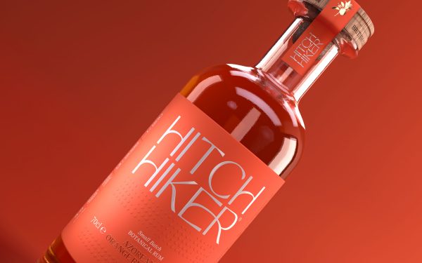 ALL THINGS DRINKS - Hitchhiker Azorean Orange Blossom Botanical Rum - Bottle Design